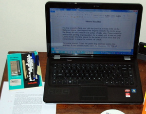 Laptop, pens and paper