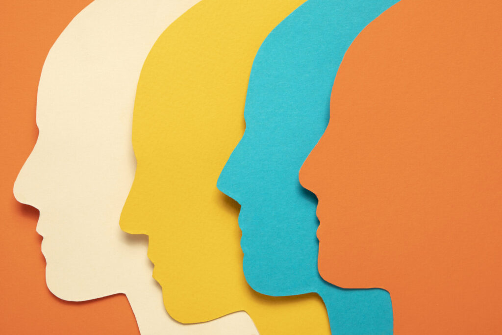 Image of four human heads by Freepik